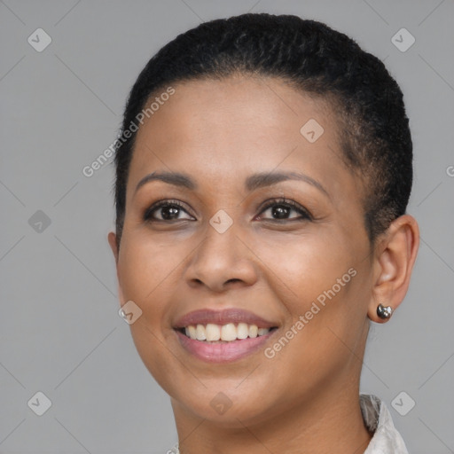 Joyful black young-adult female with short  brown hair and brown eyes