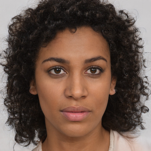 Neutral black young-adult female with medium  brown hair and brown eyes