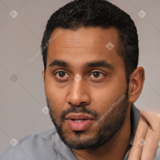 Neutral black young-adult male with short  black hair and brown eyes