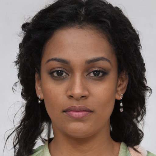 Neutral black young-adult female with long  brown hair and brown eyes