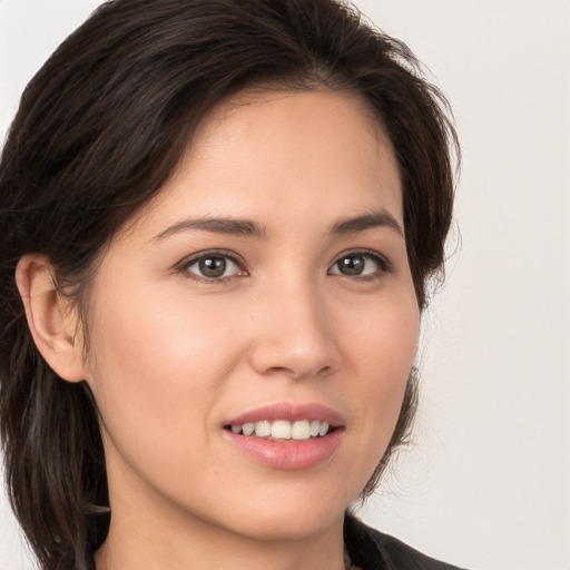 Joyful white young-adult female with medium  brown hair and brown eyes