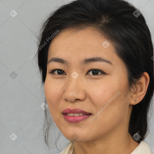 Joyful asian young-adult female with medium  brown hair and brown eyes