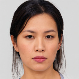 Neutral asian young-adult female with medium  brown hair and brown eyes