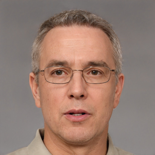 Neutral white middle-aged male with short  gray hair and brown eyes