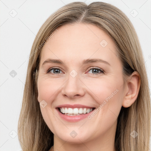 Joyful white young-adult female with long  brown hair and grey eyes