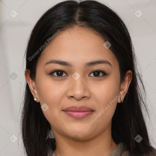 Joyful latino young-adult female with long  brown hair and brown eyes