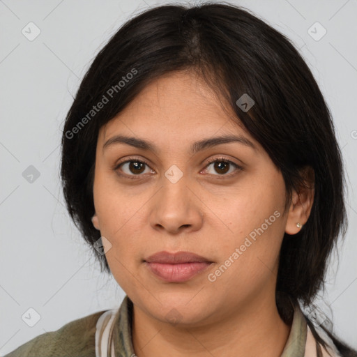 Joyful latino young-adult female with medium  brown hair and brown eyes