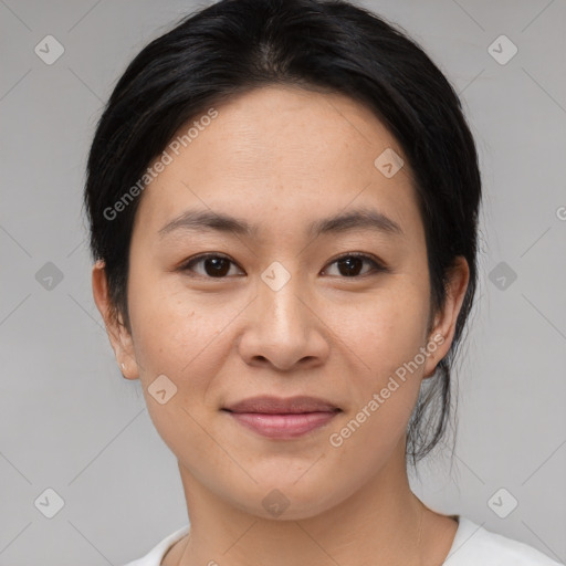 Joyful asian young-adult female with medium  brown hair and brown eyes