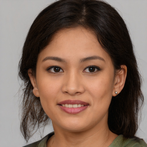 Joyful asian young-adult female with medium  brown hair and brown eyes