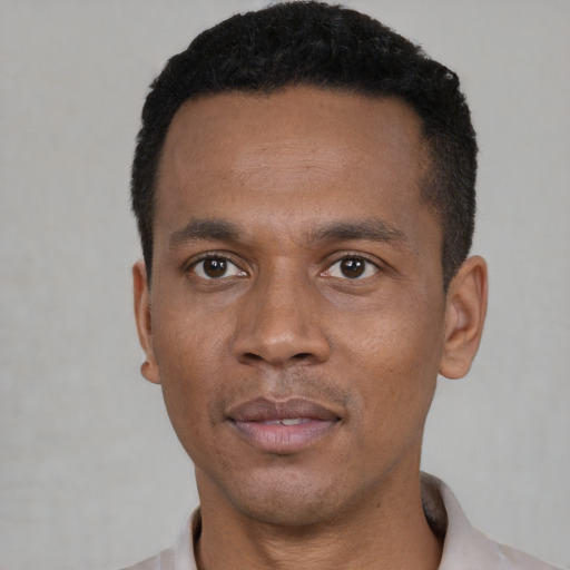 Neutral black young-adult male with short  black hair and brown eyes