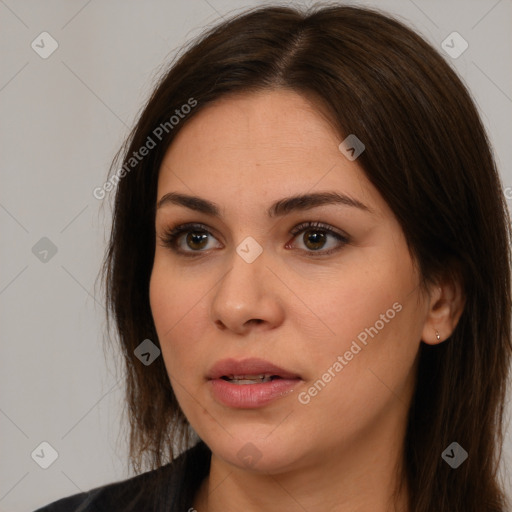 Neutral white young-adult female with long  brown hair and brown eyes