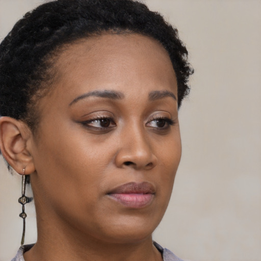 Neutral black young-adult female with short  brown hair and brown eyes