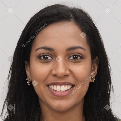 Joyful latino young-adult female with long  brown hair and brown eyes