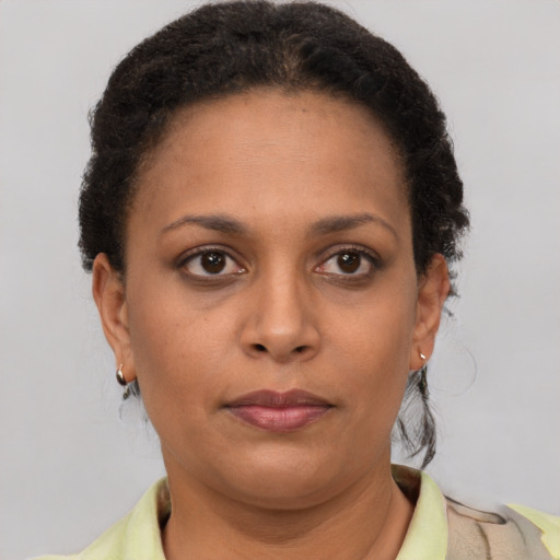 Neutral latino young-adult female with short  brown hair and brown eyes