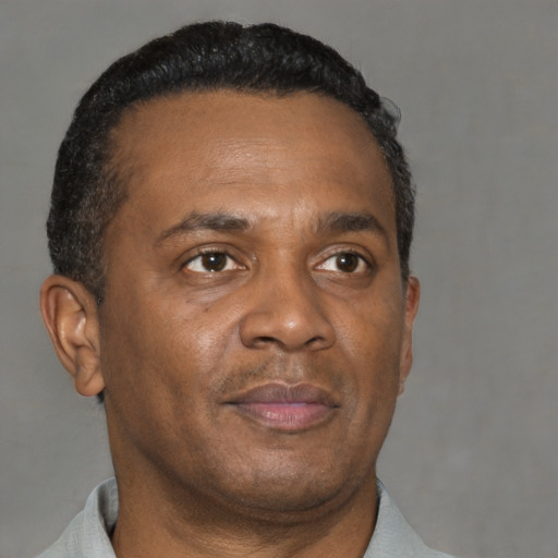 Neutral black adult male with short  brown hair and brown eyes