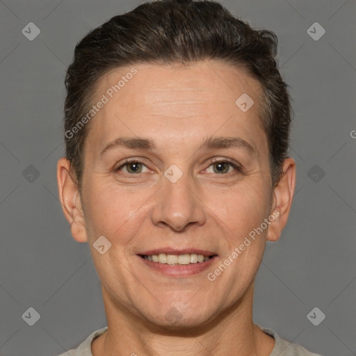 Joyful white adult female with short  brown hair and brown eyes