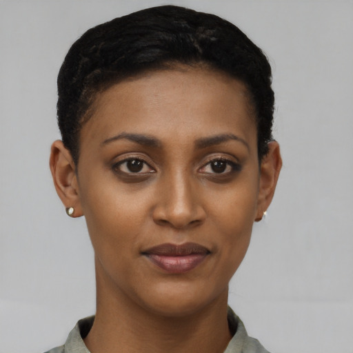 Joyful latino young-adult female with short  black hair and brown eyes