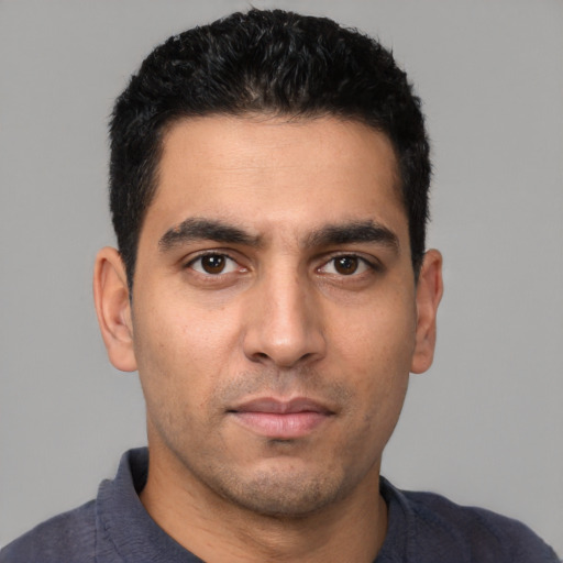 Neutral white young-adult male with short  black hair and brown eyes