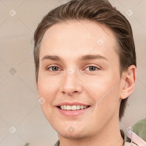 Joyful white young-adult female with short  brown hair and brown eyes