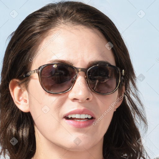 Joyful white young-adult female with medium  brown hair and blue eyes