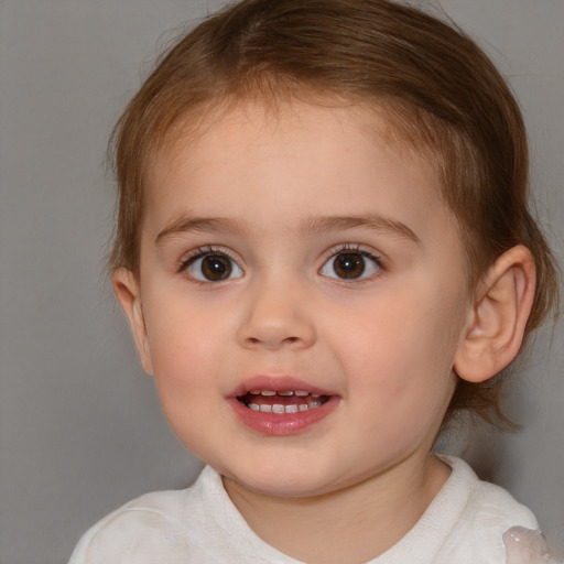 Joyful white child female with medium  brown hair and brown eyes