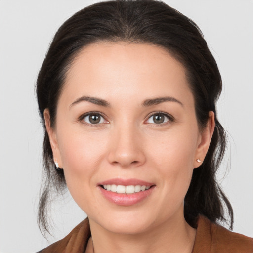 Joyful white young-adult female with medium  brown hair and brown eyes