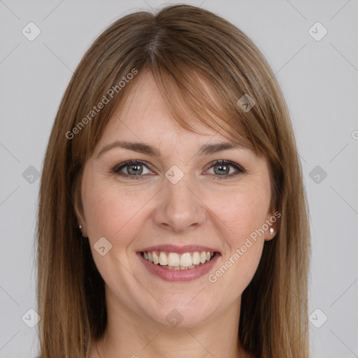 Joyful white young-adult female with long  brown hair and grey eyes