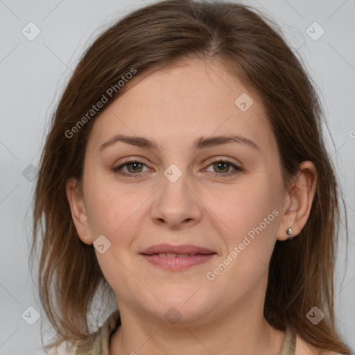 Joyful white young-adult female with medium  brown hair and grey eyes