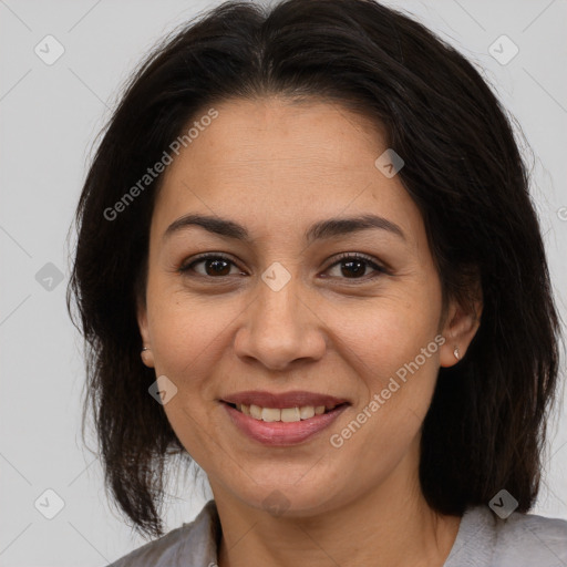 Joyful asian adult female with medium  brown hair and brown eyes