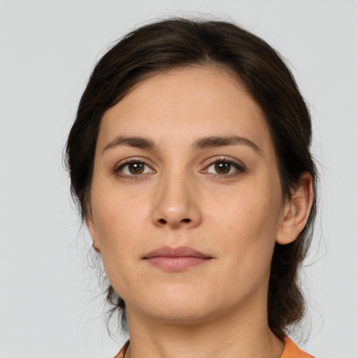Neutral white young-adult female with medium  brown hair and brown eyes