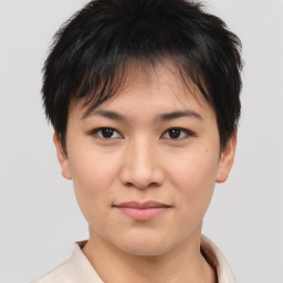 Joyful asian young-adult female with short  brown hair and brown eyes