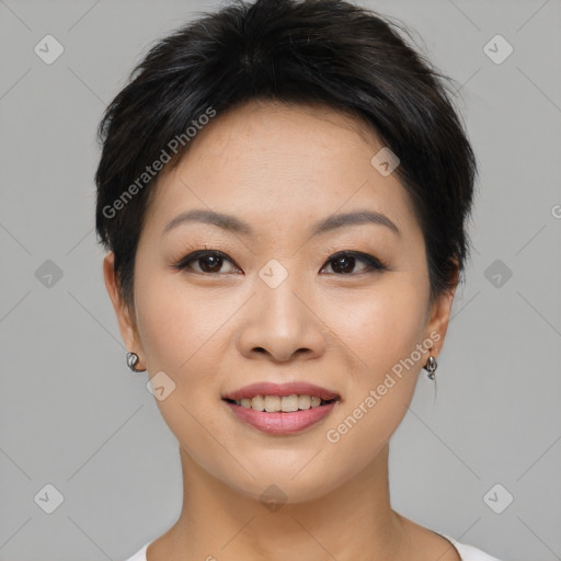 Joyful asian young-adult female with medium  black hair and brown eyes