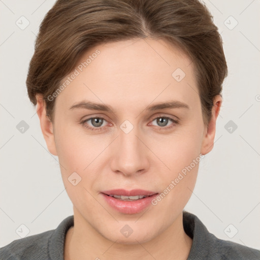 Joyful white young-adult female with short  brown hair and grey eyes