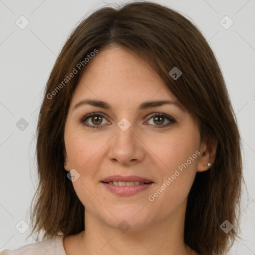 Joyful white young-adult female with medium  brown hair and green eyes