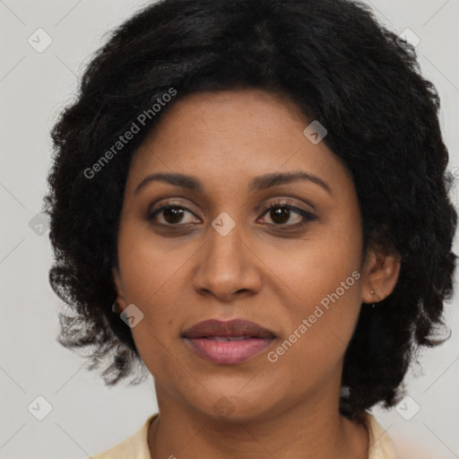 Joyful latino adult female with long  brown hair and brown eyes