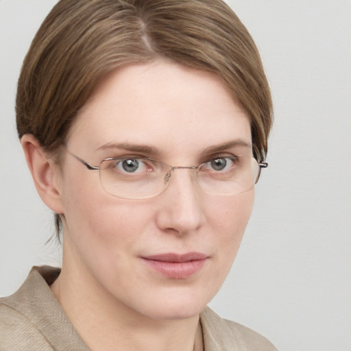 Joyful white young-adult female with medium  brown hair and blue eyes