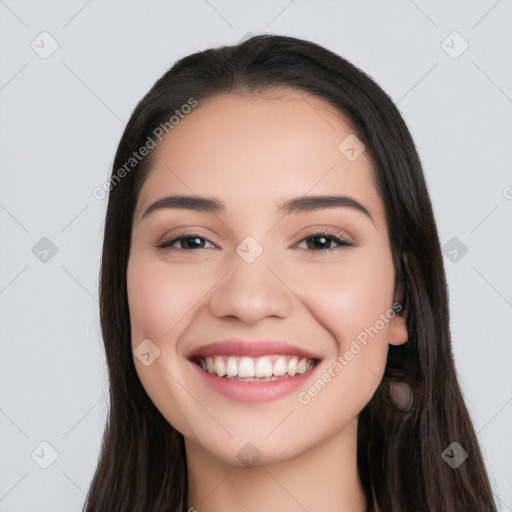 Joyful white young-adult female with long  black hair and brown eyes