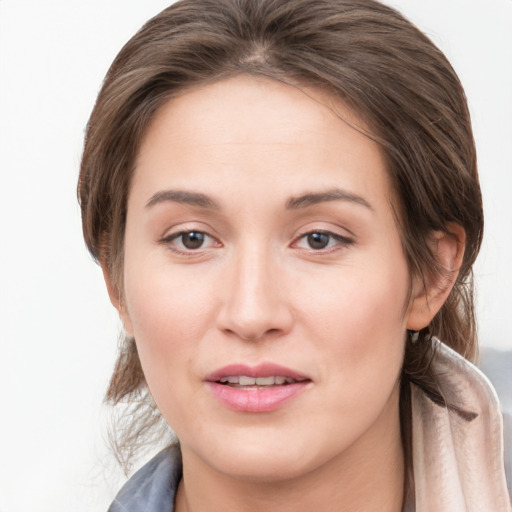 Joyful white young-adult female with medium  brown hair and grey eyes