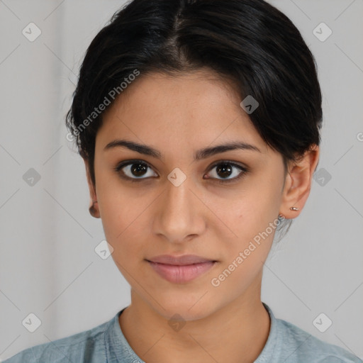 Joyful latino young-adult female with medium  brown hair and brown eyes