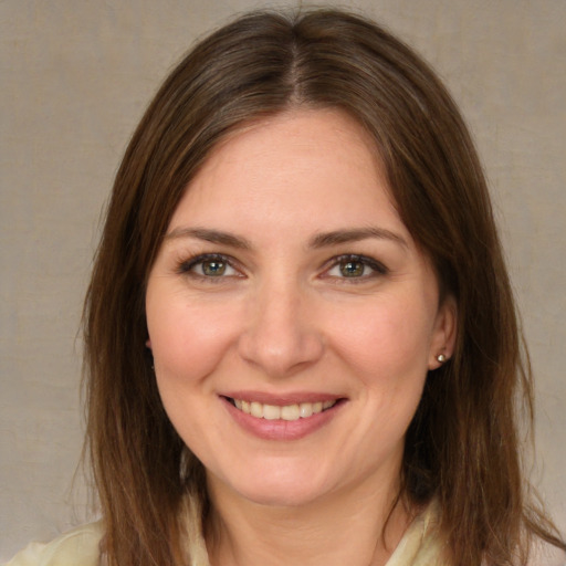 Joyful white young-adult female with medium  brown hair and brown eyes