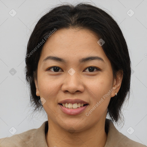 Joyful asian young-adult female with medium  brown hair and brown eyes