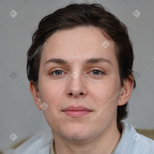 Joyful white adult female with short  brown hair and grey eyes