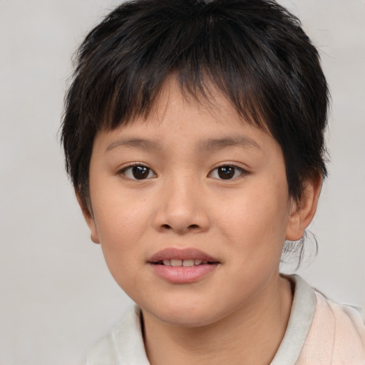 Joyful asian child female with short  brown hair and brown eyes