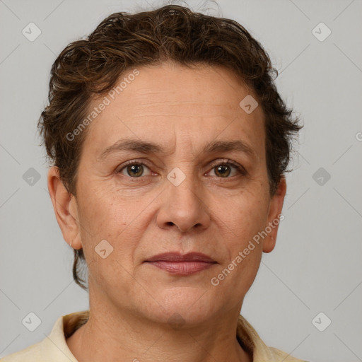 Joyful white adult female with short  brown hair and brown eyes