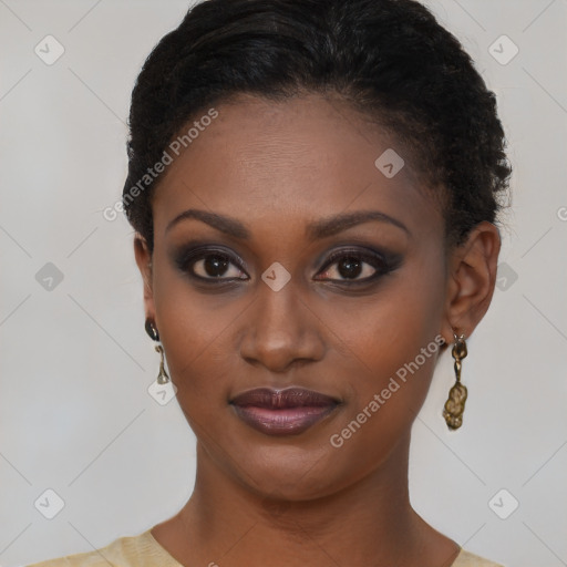 Joyful black young-adult female with short  brown hair and brown eyes
