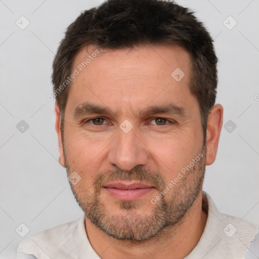 Joyful white adult male with short  brown hair and brown eyes