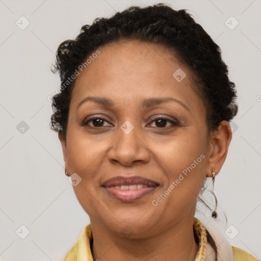 Joyful latino adult female with short  brown hair and brown eyes