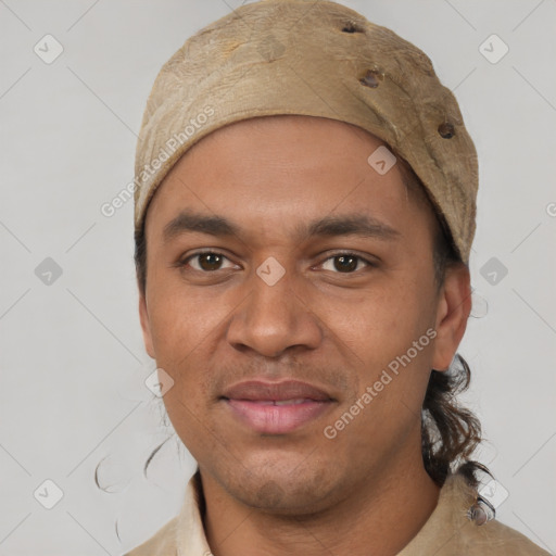 Joyful white adult male with short  black hair and brown eyes