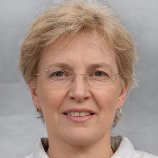 Joyful white middle-aged female with short  brown hair and blue eyes