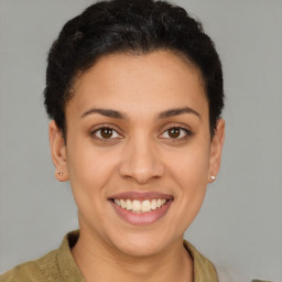 Joyful latino young-adult female with short  brown hair and brown eyes